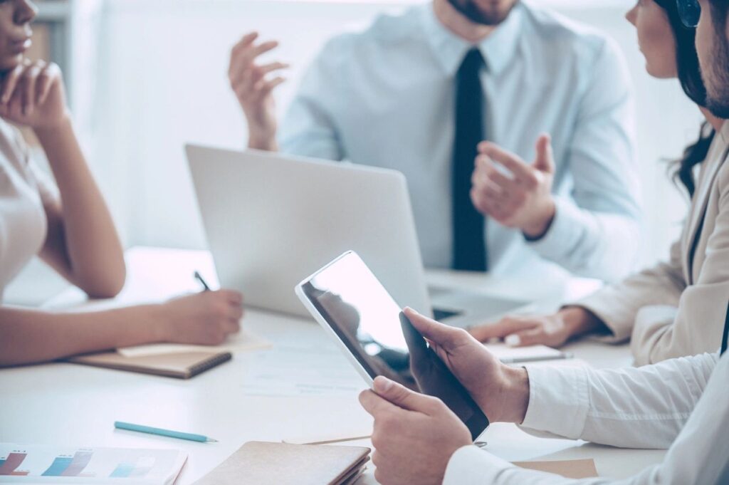 business meeting with tablet and laptop
